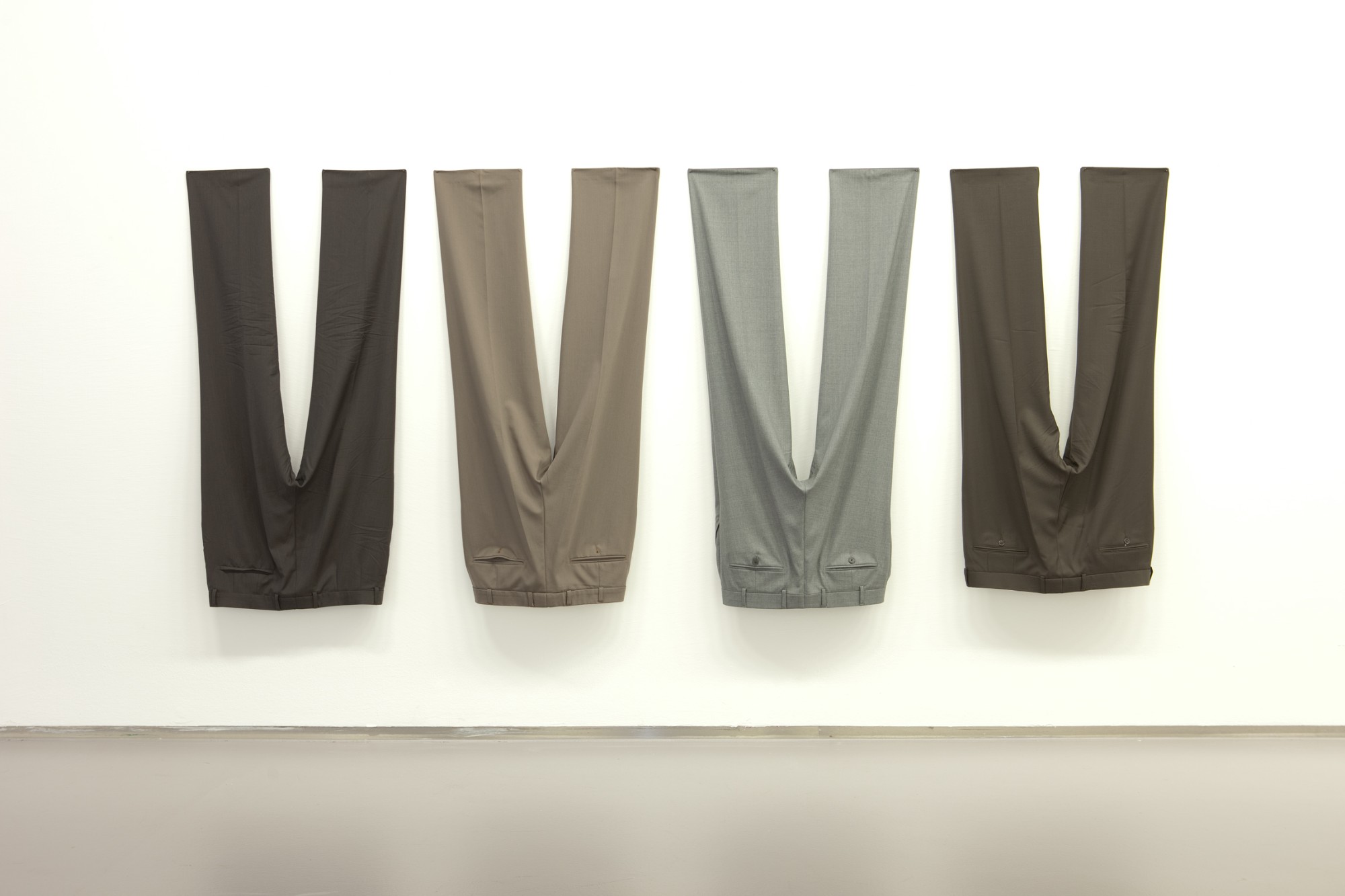 Anna Kolodziejska, Ohne Titel (A, B, C, D), 2012, 4 men trousers, 110 x 250 x 17 cm